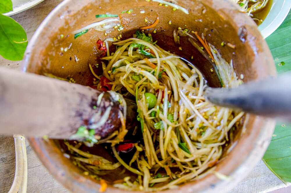 "Pok Pok" is the sound of making som tum Thai in a mortar and pestle