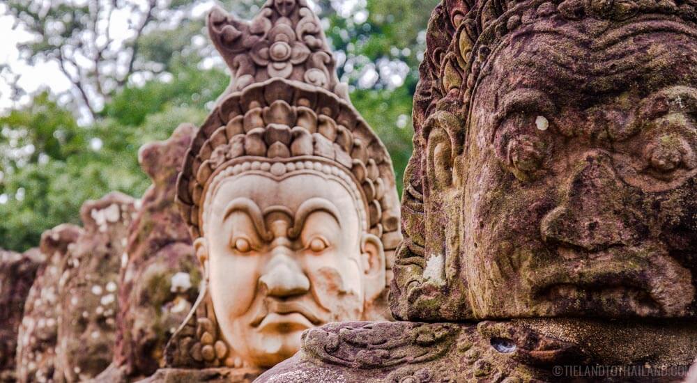 Walk pass these statues on your one or three day itinerary to Angkor